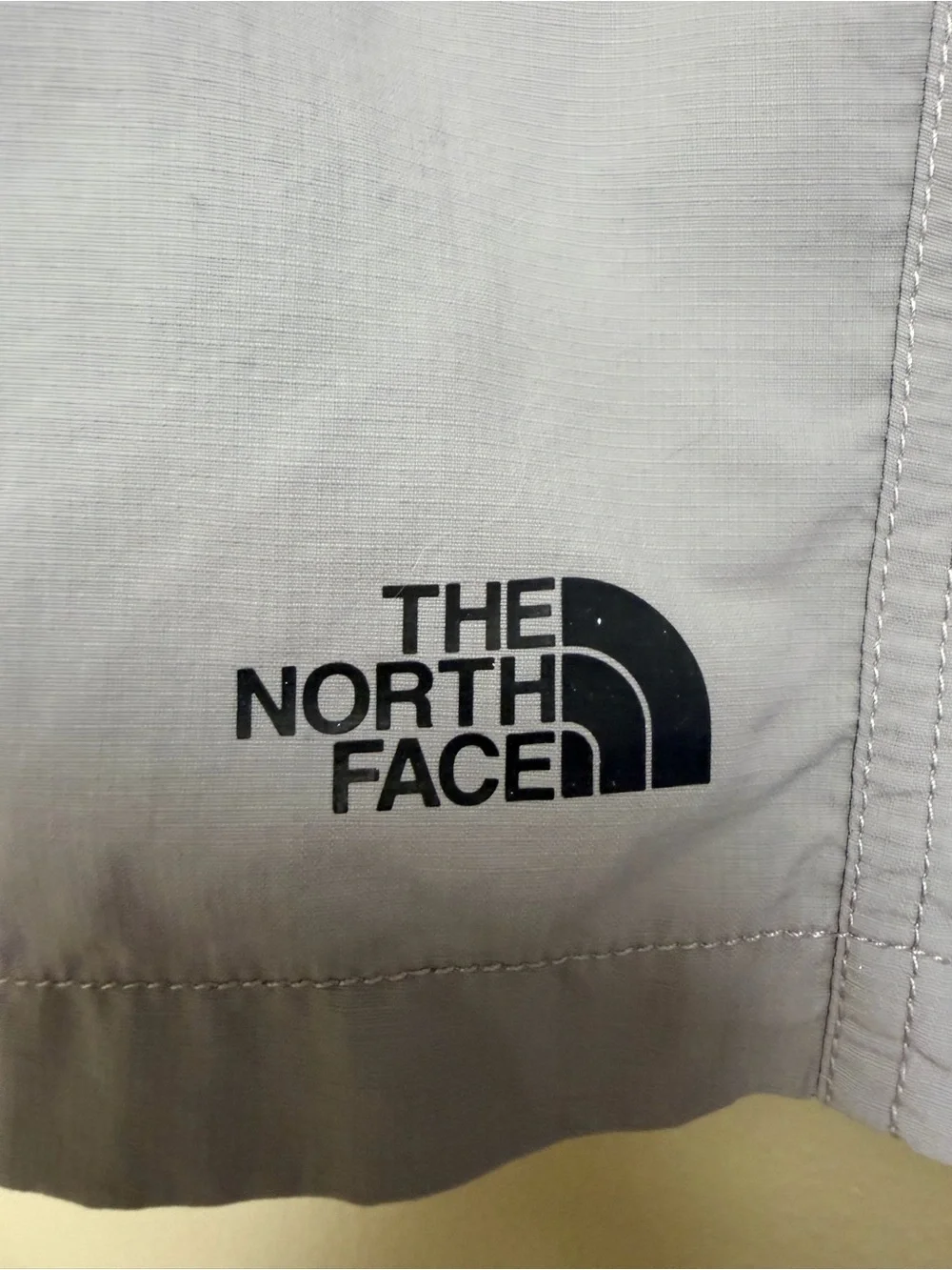 The North Face Light Gray Shorts with Black Logo